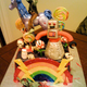 Illustration for article titled There is nothing better than the unicorn-riding rainbow zombie cake